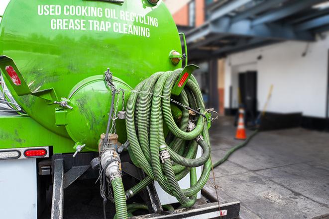 a grease trap pumping truck at a restaurant in Atwater, CA